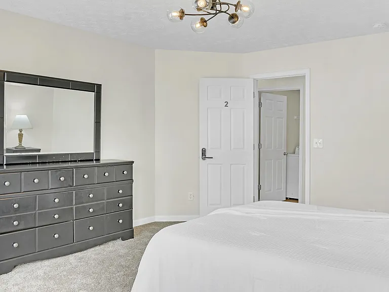 Extra storage with Dresser and mirror and closet.