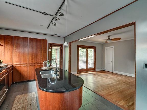 Custom-Built Chef's Kitchen & Sunny Breakfast Room with access to Screened-In Patio