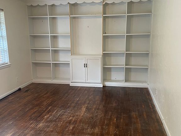 Built in shelves are the highlight of the 11.5' x 17' living room.