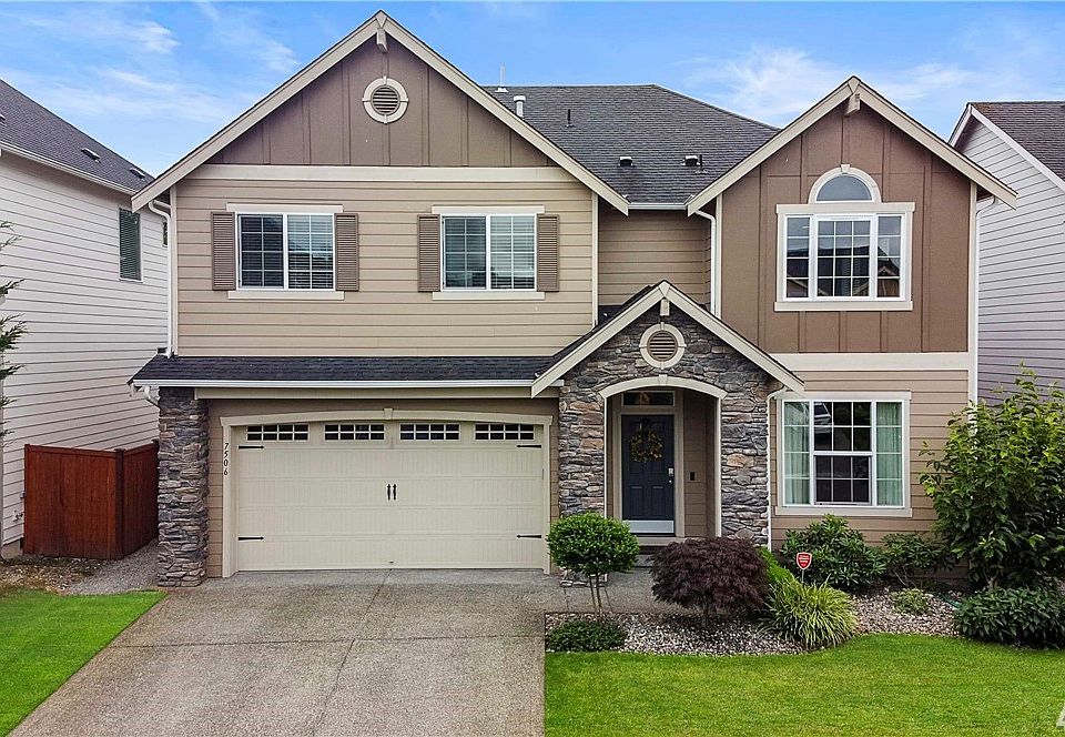 Beautiful curb appeal with upgraded elevation featuring stone accents, decorative trim and garage door hardware.