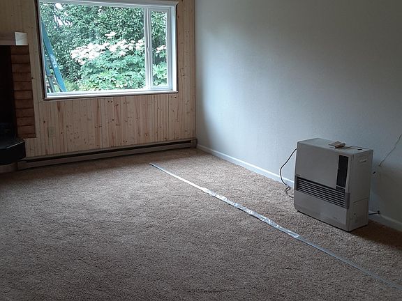 Living room, new Toya stove has been installed since photo taken.