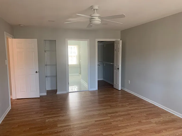 Master Bedroom with Her Closet and Linen closet.