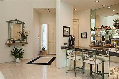 Spacious entry with wet bar.