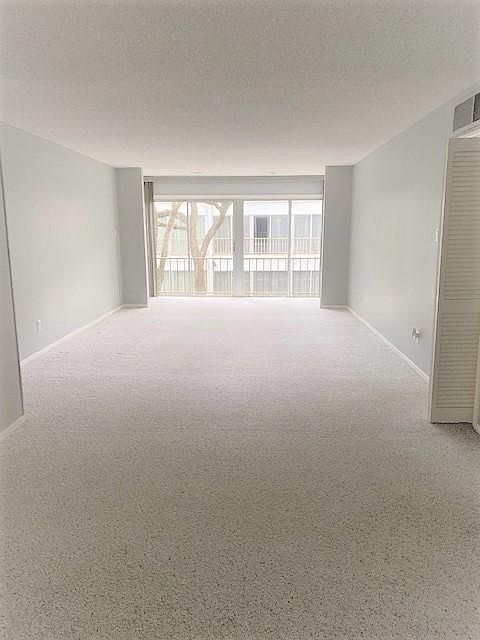 As you walk in the front door, the expansive Living/Dining area that overlooks the gorgeous courtyard is so large and can be used in a multitude of ways.