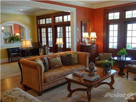 The living room is open and directly across from the kitchen with plenty of large windows providing wonderful views of the Bayou and a set of French doors that open to the covered terrace.