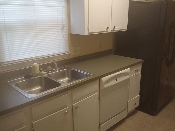 Kitchen with black stove and dishwasher.