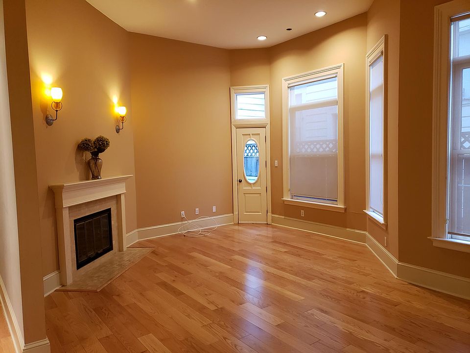 The living room with fire place and access to small deck.