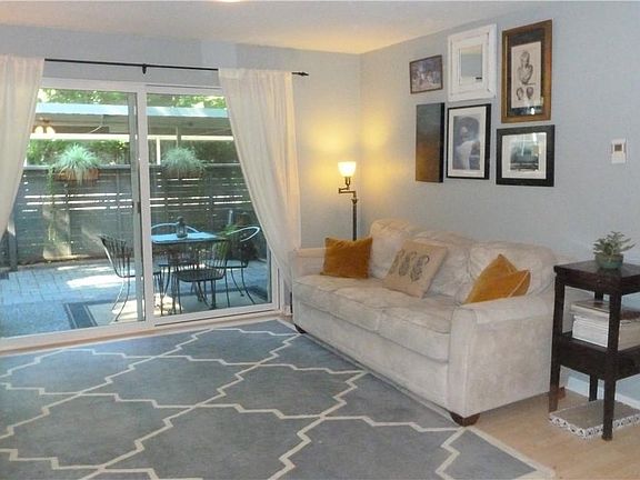 Living room with wood burning fireplace and full size mantel