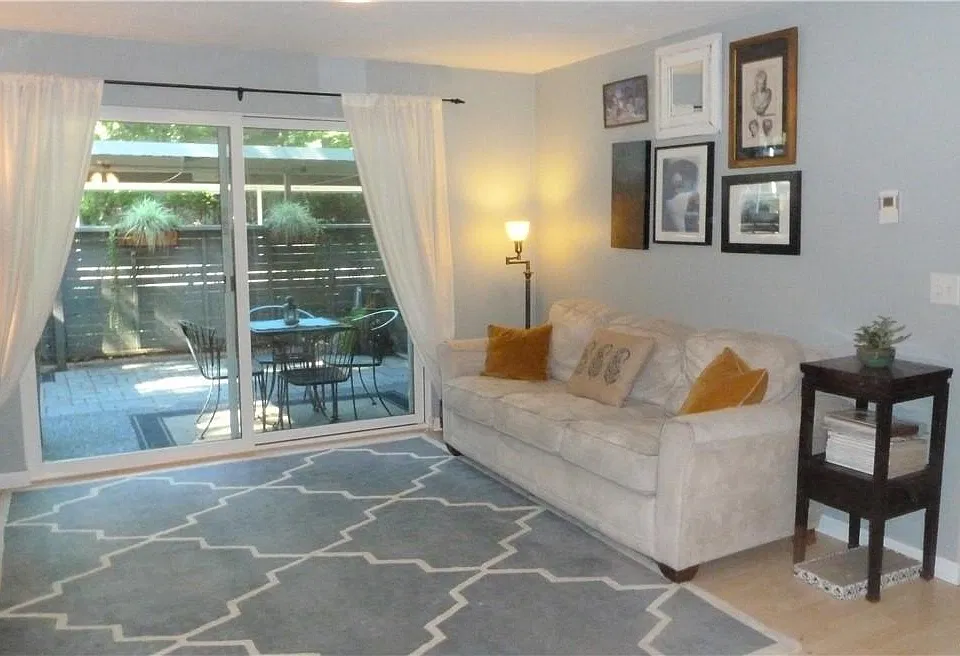 Living room with wood burning fireplace and full size mantel
