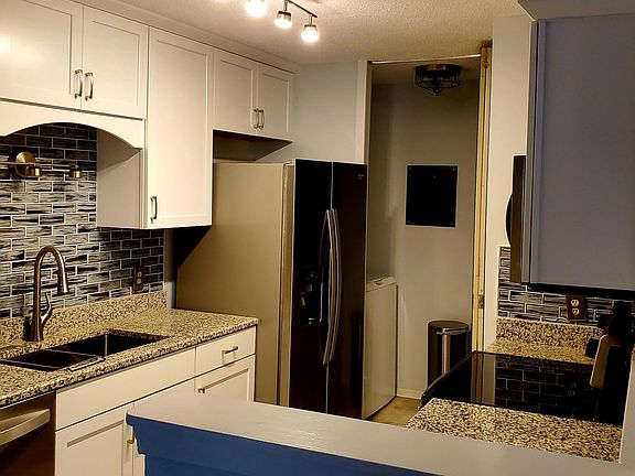Renovated Kitchen with high end finishes and separate laundry room at the back