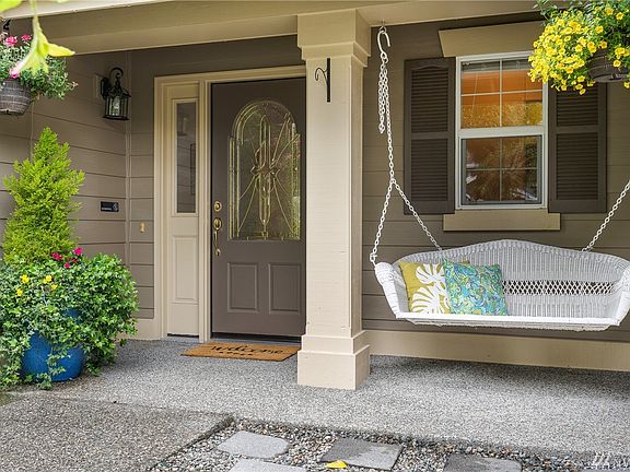 You'll love sitting and relaxing on the front porch swing.