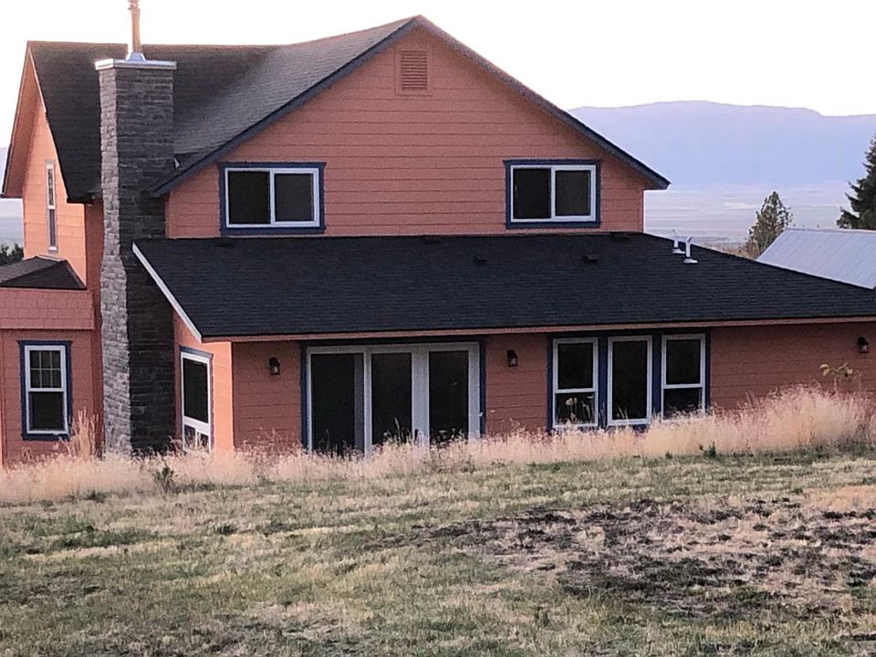 View of the back of the house. Sliding door off the dining area opens up to a view of Mt. Fanny.