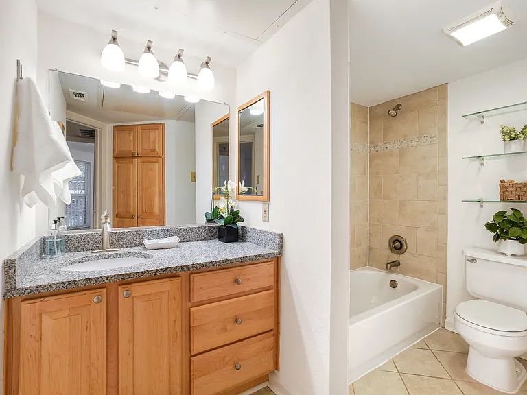 Large bathroom with loads of storage and counter space.