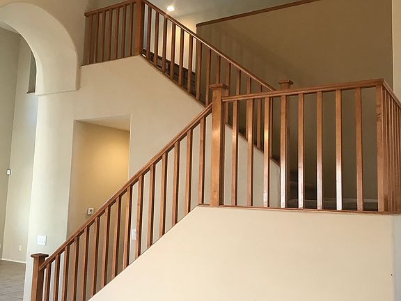 Vaulted ceilings, beautiful stairway leading upstairs to 3 bedrooms, large loft, upper bathroom and flex space.