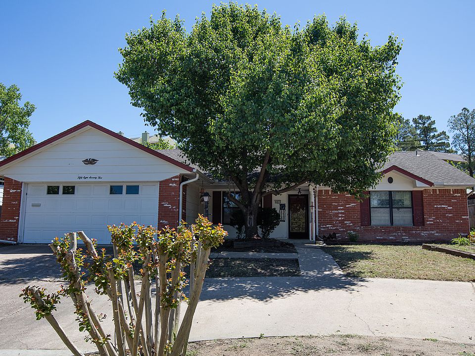 Charming one-story bungalow on greenbelt boasts circle drive, huge backyard, beautifully updated kitchen and awesome sun room!