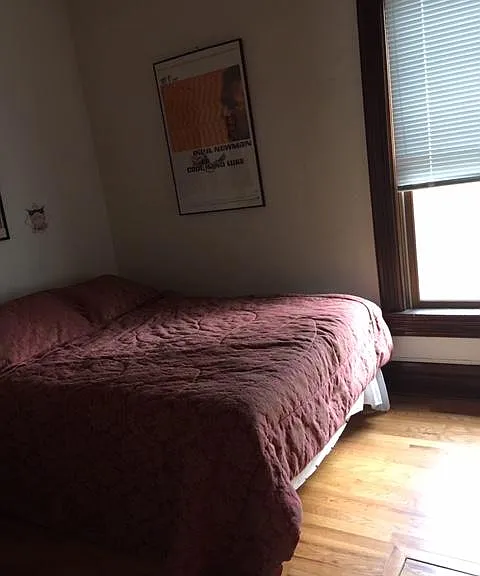 another photo of smaller bedroom before all walls of the house have been freshly painted