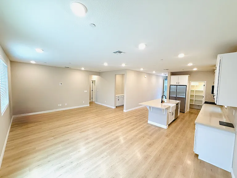 Living area with view to downstairs guest bedroom/bath towards the left.