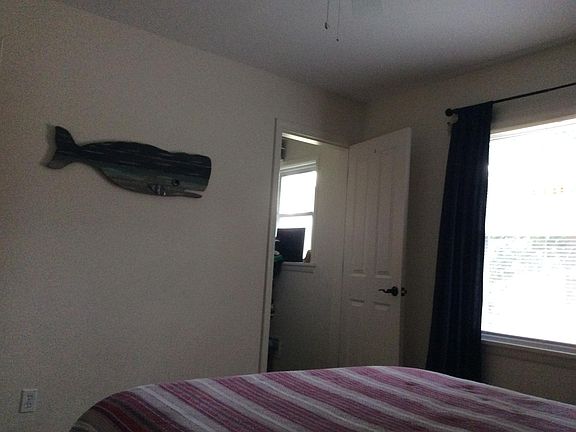 One of three bedrooms, with walk in closet.