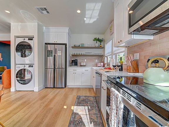 Our kitchen is fully stocked with all of the essentials for cooking family meals. Appliances include a dishwasher, range, microwave, refrigerator, washer, dryer.