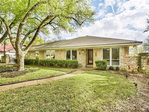 A gently curving sidewalk welcomes you home.