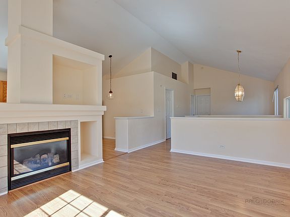 View from living room towards kitchen & loft areas.