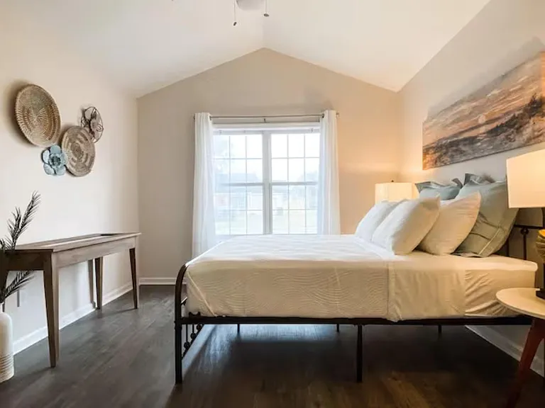 Master bedroom has vaulted ceiling and great natural lighting.