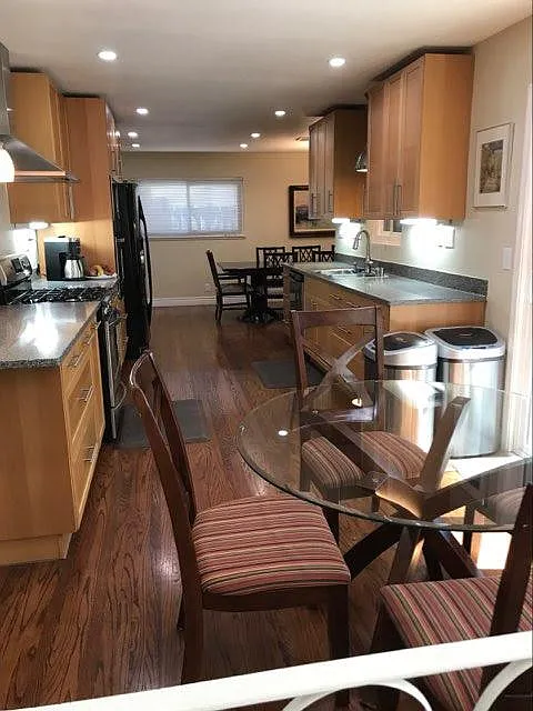 Spacious kitchen with eat in area by sliding glass door which lets in lots of light - 1138 S Daniel Way