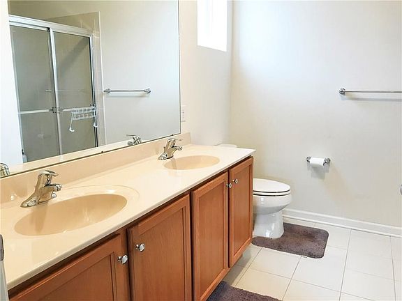 Master bath with his and her sinks and very large walk in shower.