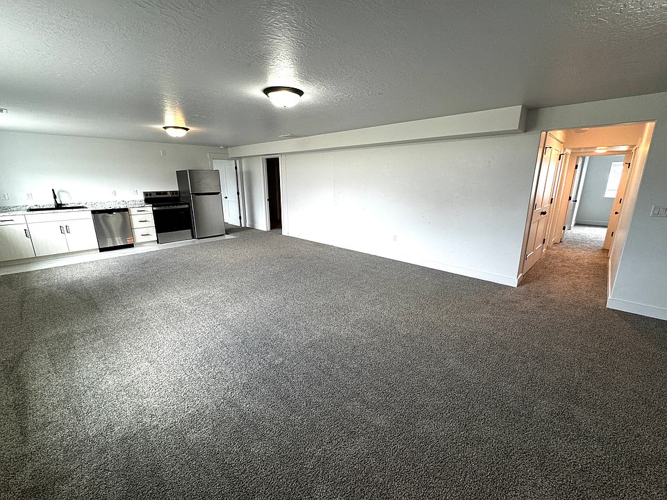 Large open living space, carpet in new condition with LVP being installed to expand kitchen/dining