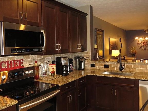 Soft close cabinets, stainless steel appliances, and granite countertops.