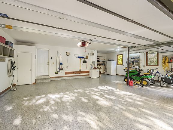 Over-sized 3 car garage is fully insulated, heated, and has a fresh epoxy floor!