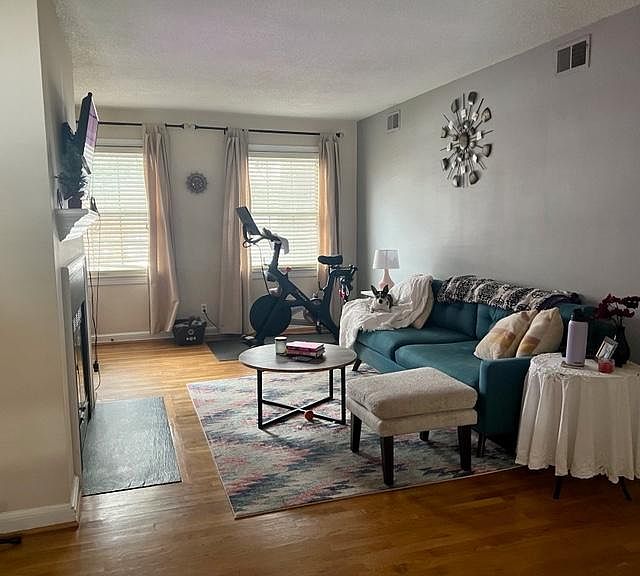 Living Area. Two windows face front of building, large grassy area