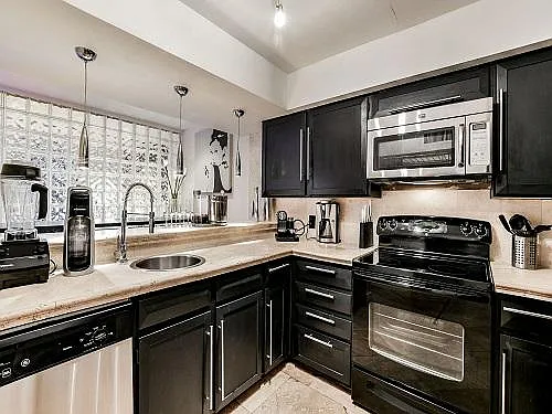 Spacious Modern Kitchen with a dine-in bar