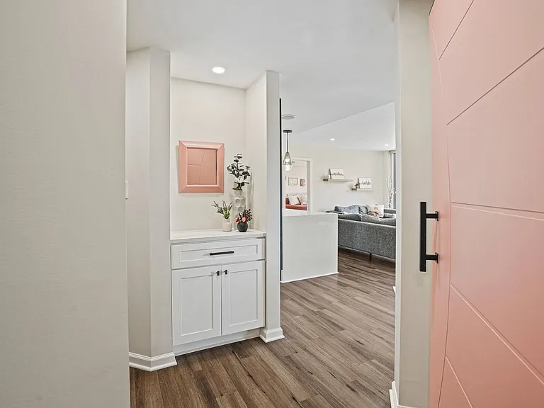 arm and welcoming entryway featuring clean, modern finishes and a seamless transition into your home