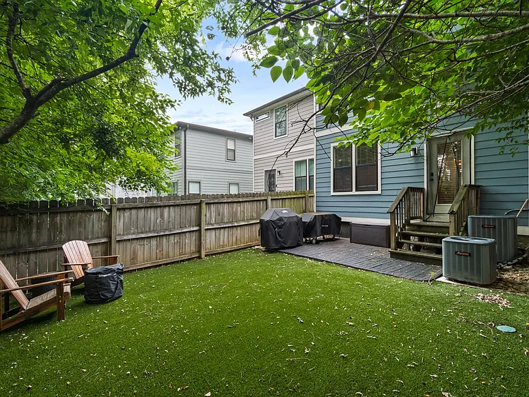 Green all year with NO maintenance! The grill and the Adirondack chairs will remain for your enjoyment!