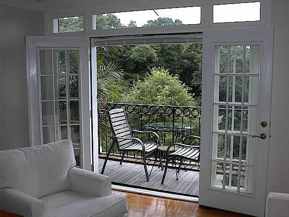 Living room opens to the trees.