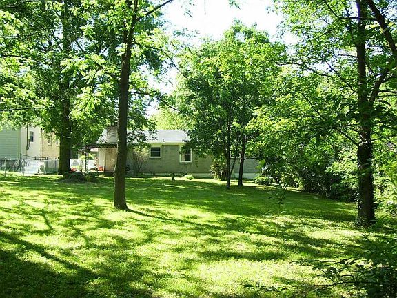 Shaded back yard w/mature trees