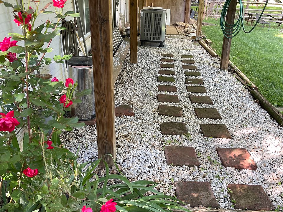 Walk under deck to access front door to the apartment.