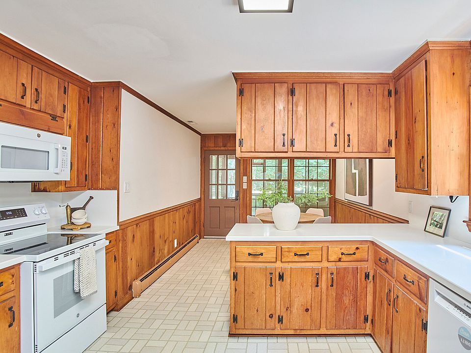 Kitchen and breakfast room, looking out to the screened porch.