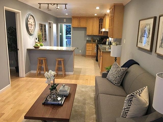 Living room opens to kitchen