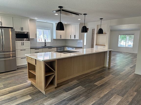Kitchen island, view from gas fireplace in dining room