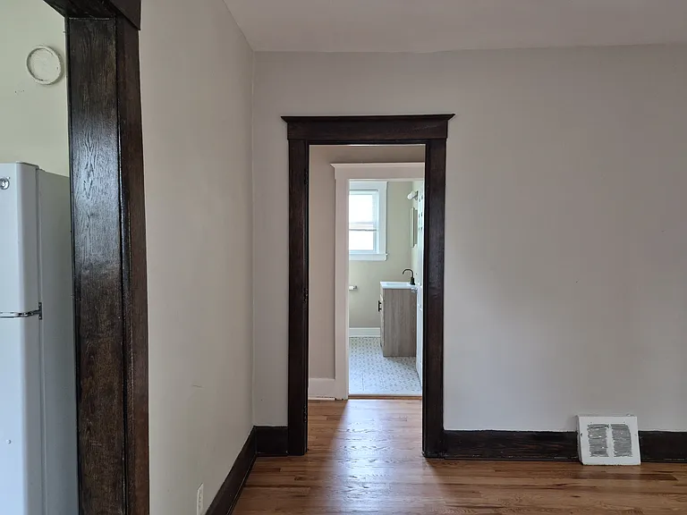 View of hall and bathroom from the dining room.
