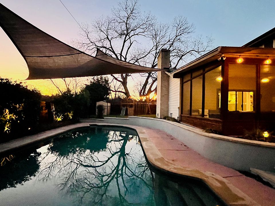 The screened-in porch with ceiling fans is perfect for those warm Texas nights.