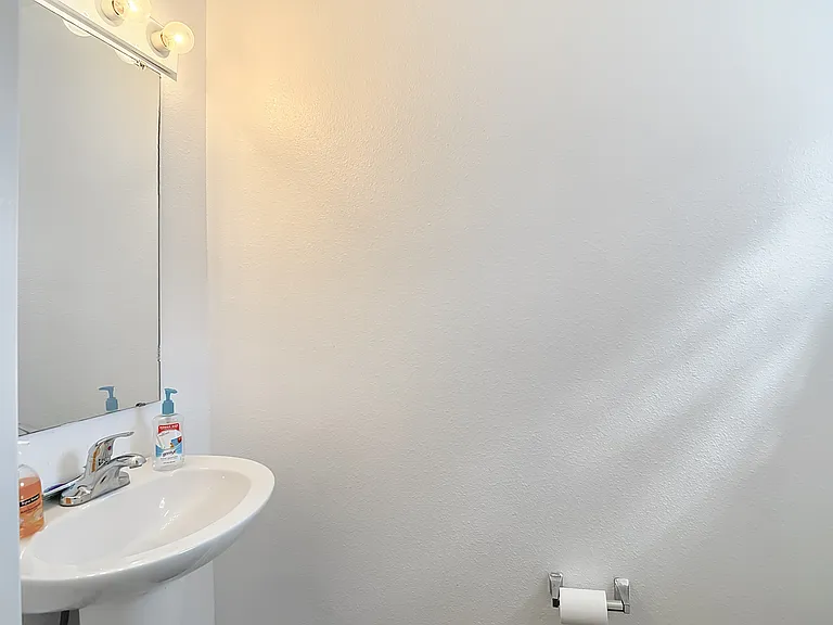 Shared downstairs half bath.