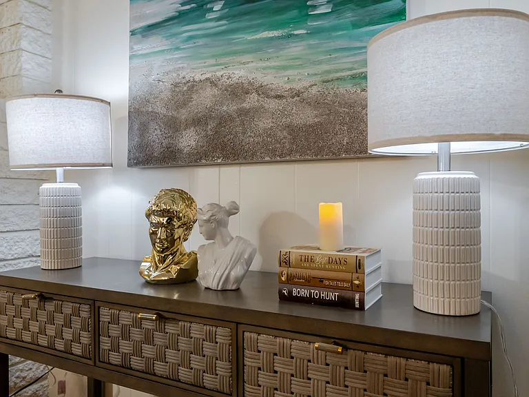 Cozy up and unwind with a good book in this inviting living room.