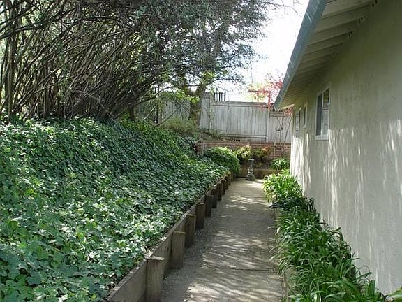 Walk way at south side (rear) of the unit.