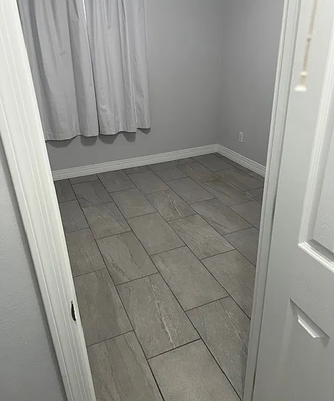 Second Floor Third (3) Bedroom, Brand New Tile and Grout, New Baseboard Molding, New Curtains, Ceiling Fan with Light, Large Wall Closet.