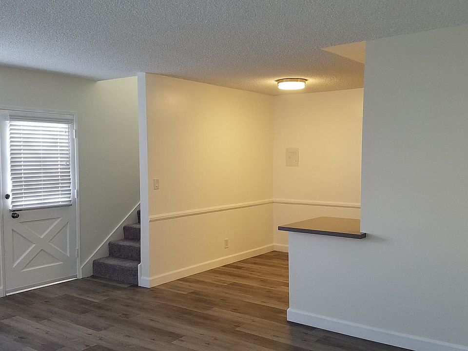 Staircase to second floor and breakfast area outside kitchen