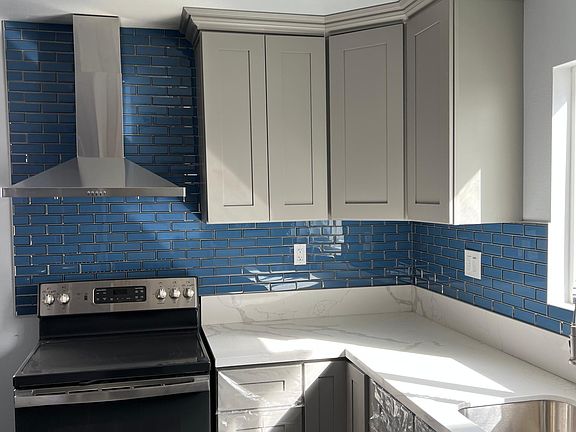 All new Kitchen with brand new electric stove and garbage disposal.