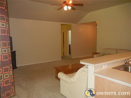 Vaulted ceilings and overhead fan in Family room